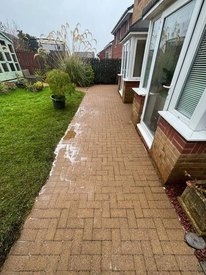 The same monobloc path after pressure washing, clean and bright