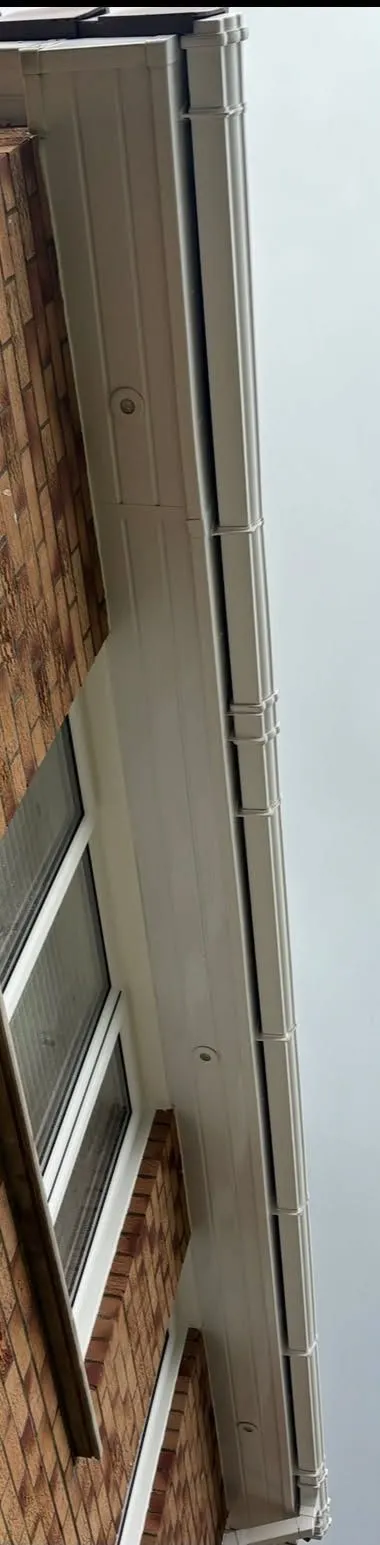 The same soffit and fascia after cleaning, bright white